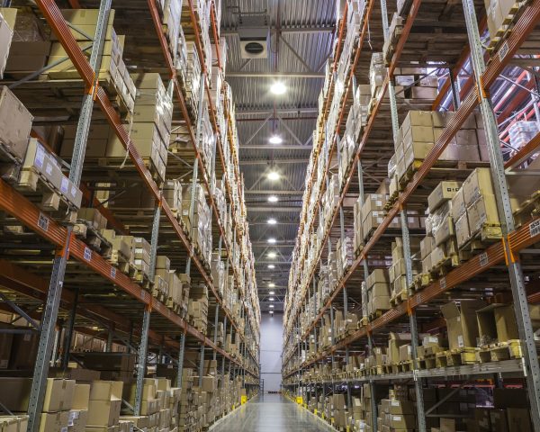 Interior of warehouse with racks full of boxes